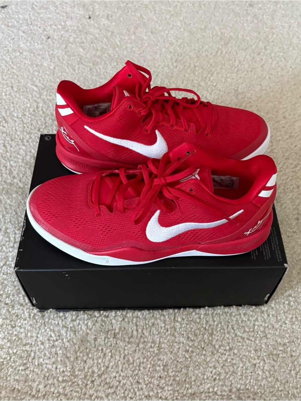 Nike Women’s Red Sneakers with White Swoosh